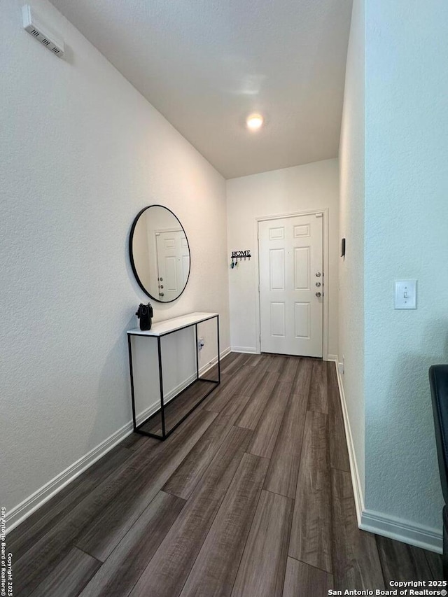 interior space with dark hardwood / wood-style flooring