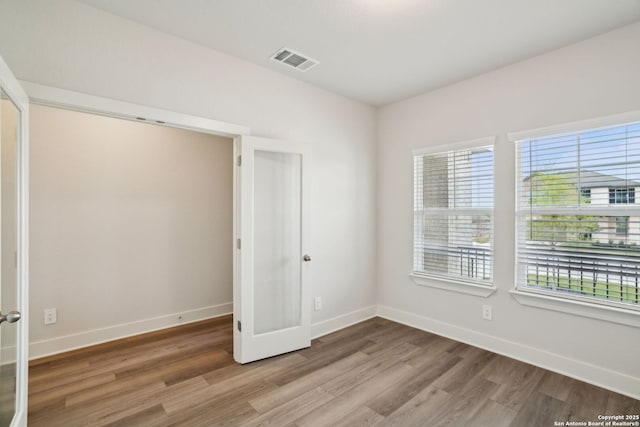 5712 Beths Way, San Antonio, TX 78253 - spare room featuring wood finished floors, healthy amount of natural light, and baseboards