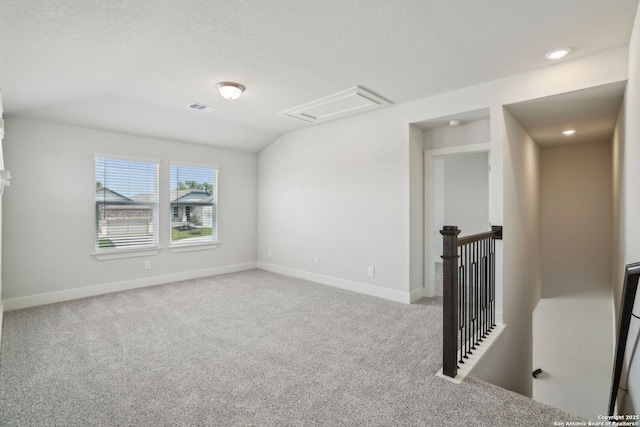 5712 Beths Way, San Antonio, TX 78253 - carpeted spare room with attic access, baseboards, vaulted ceiling, and recessed lighting