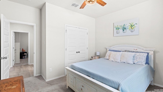 2437 Hiddenbrooke Trce, Seguin, TX 78155 - bedroom featuring ceiling fan, light colored carpet, and a closet