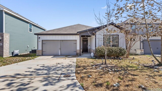2437 Hiddenbrooke Trce, Seguin, TX 78155 - view of front of property with a garage and central air condition unit