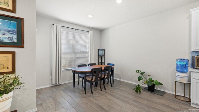 2437 Hiddenbrooke Trce, Seguin, TX 78155 - dining space featuring light wood-type flooring