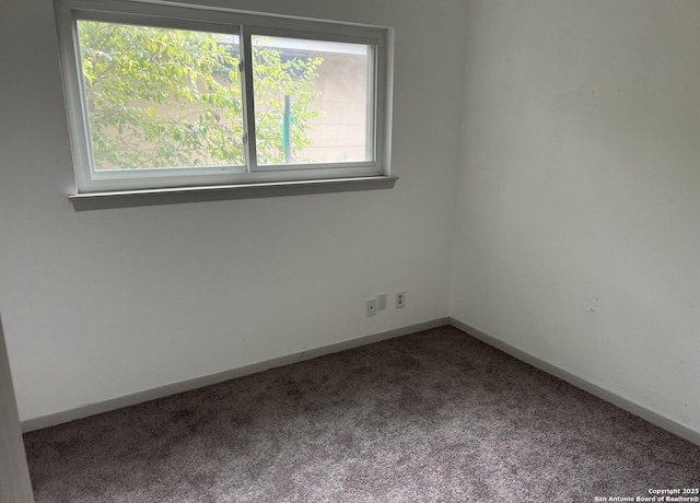 empty room featuring carpet flooring