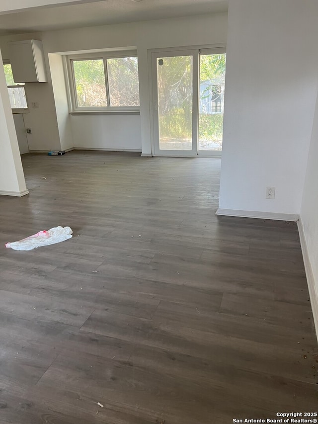 unfurnished living room featuring hardwood / wood-style flooring