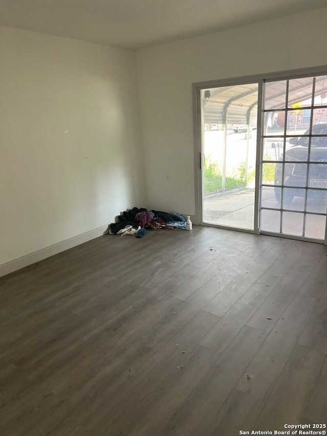 spare room with hardwood / wood-style flooring