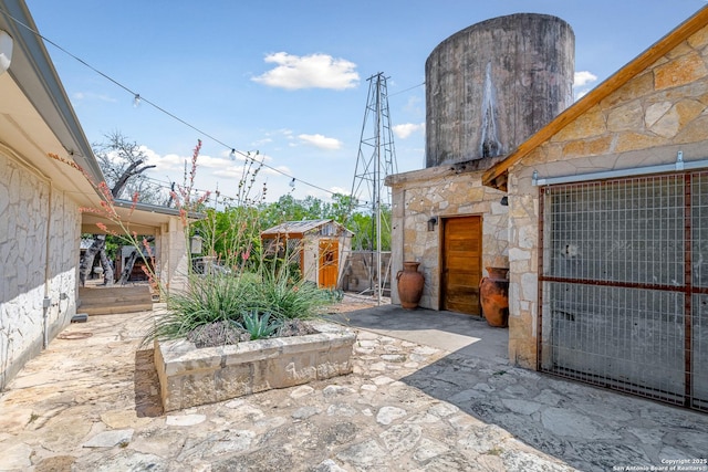 view of patio / terrace with a storage shed