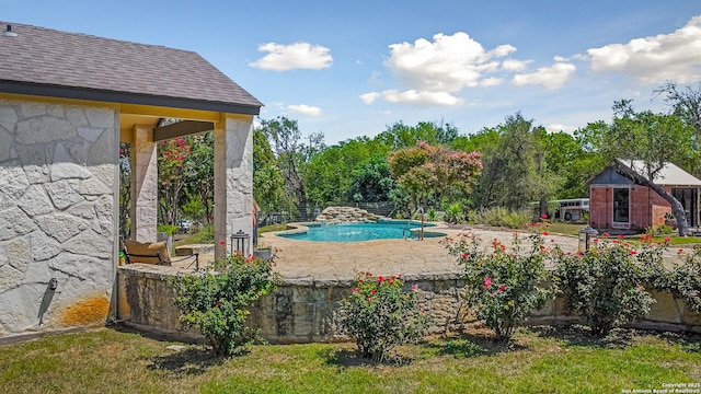 view of swimming pool featuring a patio area