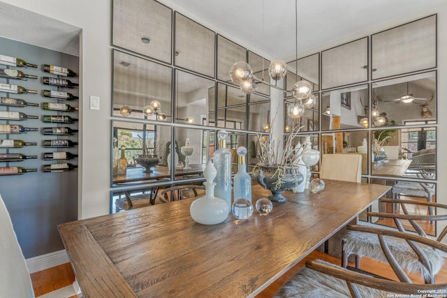 dining room featuring hardwood / wood-style floors and ceiling fan