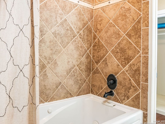 bathroom with a tub