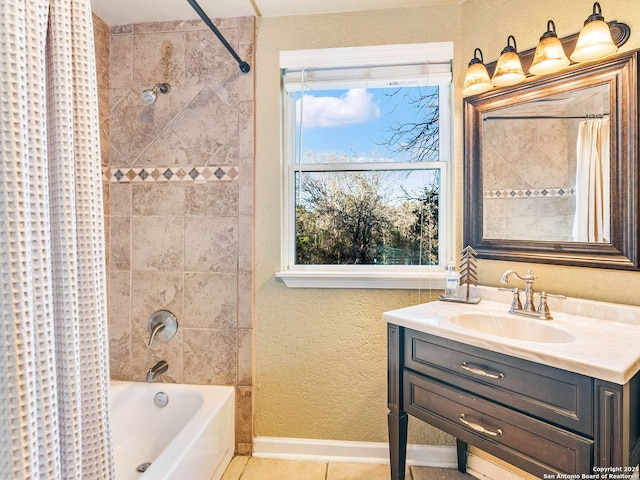 bathroom featuring tile patterned floors, vanity, and shower / bath combo