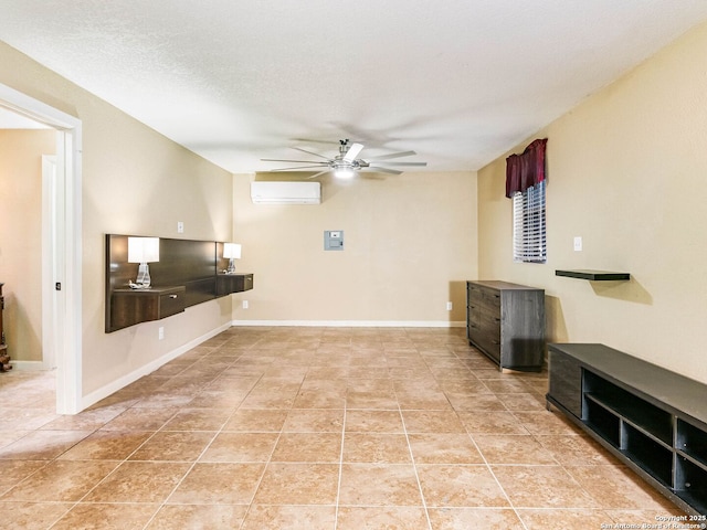 unfurnished living room with ceiling fan, light tile patterned floors, a textured ceiling, and a wall unit AC