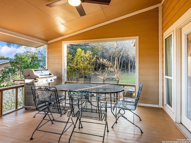 deck with area for grilling and ceiling fan