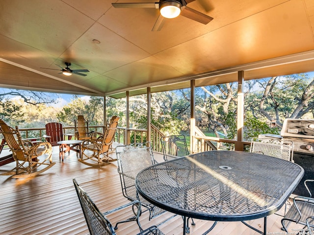 sunroom with vaulted ceiling and ceiling fan