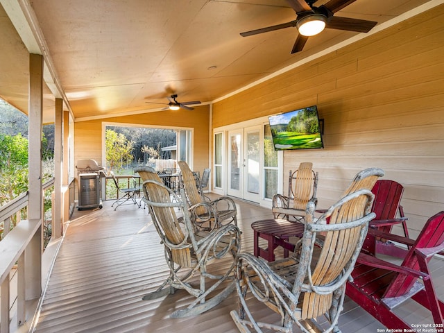 wooden deck with french doors and ceiling fan