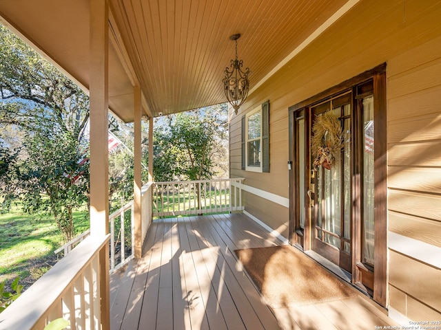 wooden terrace with a porch