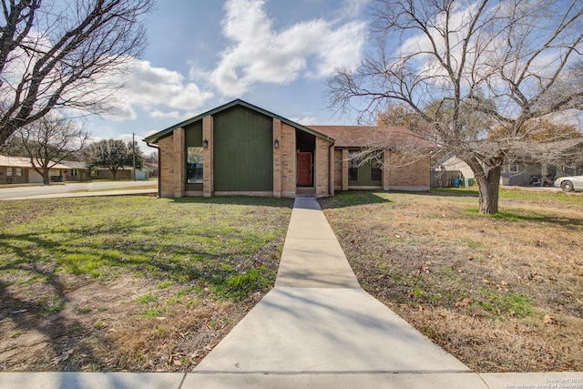 ranch-style house with a front lawn