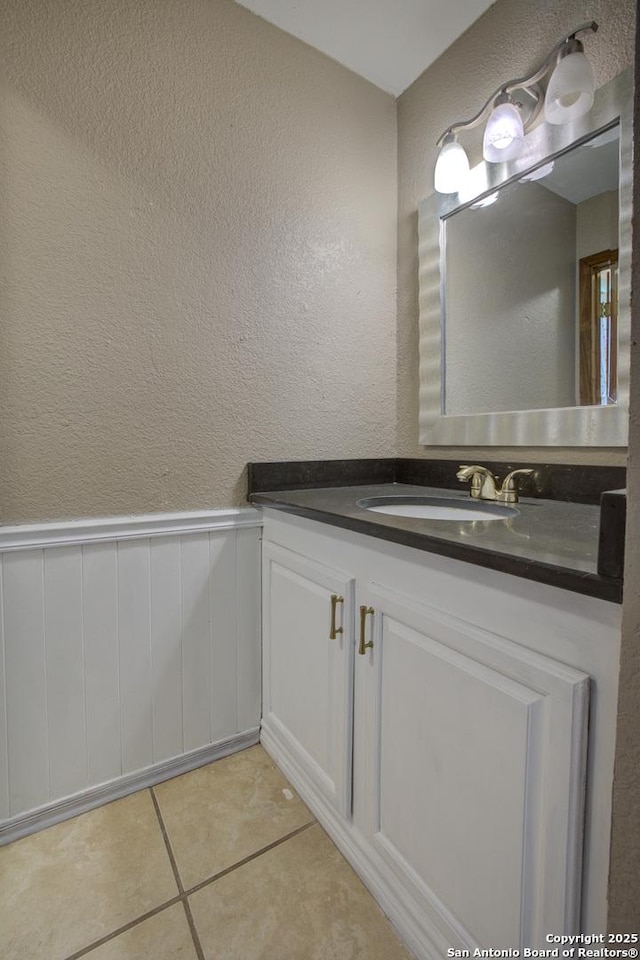 bathroom with vanity and tile patterned flooring