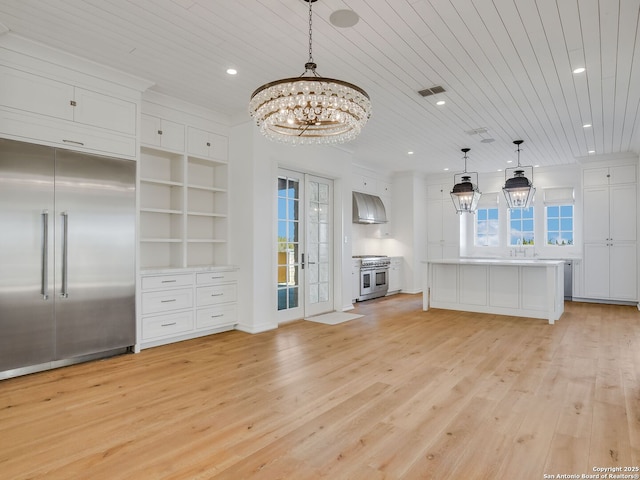 unfurnished living room featuring wood ceiling, built in features, an inviting chandelier, light hardwood / wood-style floors, and french doors