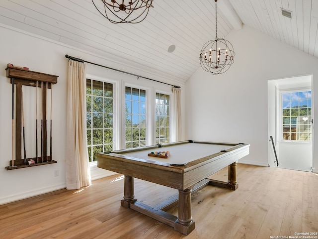 game room with beamed ceiling, plenty of natural light, and light hardwood / wood-style floors