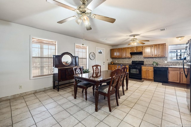 dining space featuring light tile patterned floors and ceiling fan