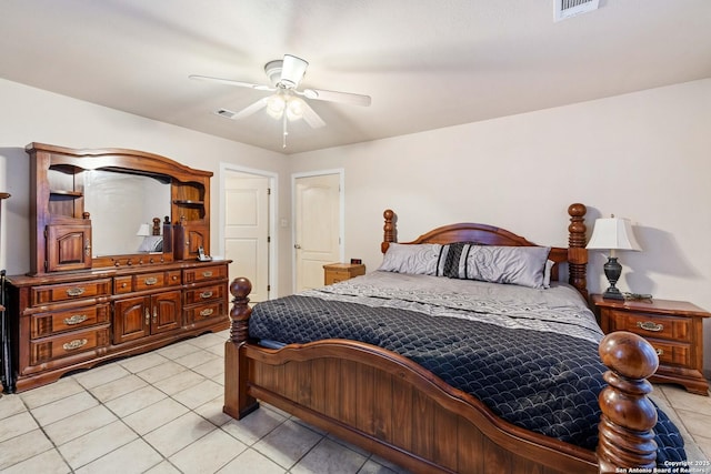 tiled bedroom with ceiling fan