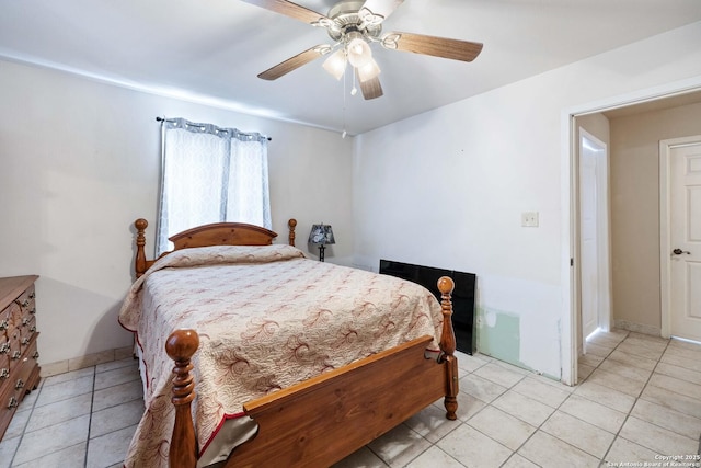 tiled bedroom with ceiling fan