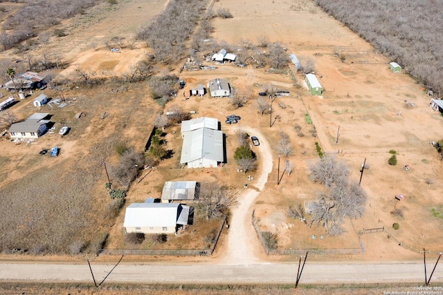 birds eye view of property featuring a rural view