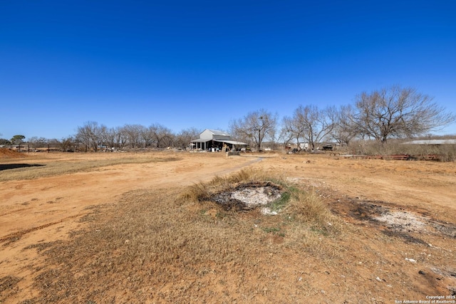 view of yard with a rural view