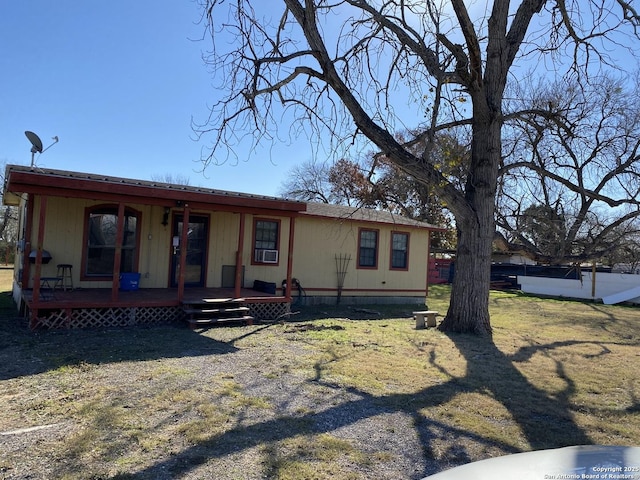 view of front of property with a front yard and a porch