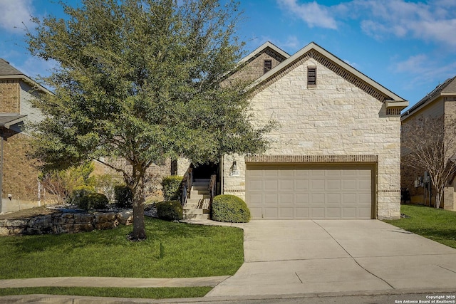 view of front of house featuring a front yard, stone siding, and driveway