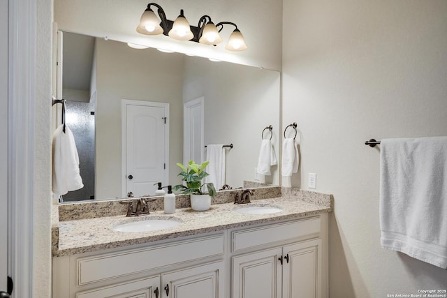 bathroom featuring double vanity and a sink