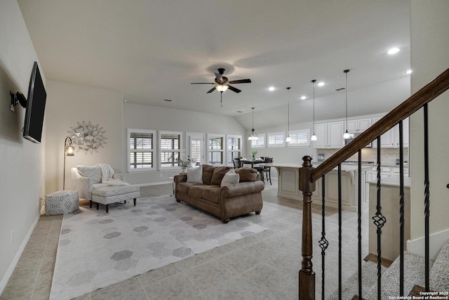 living room with ceiling fan, lofted ceiling, recessed lighting, baseboards, and stairway