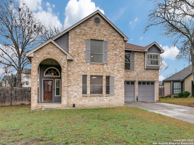 view of front of property featuring a garage and a front yard