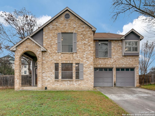 view of front of home featuring a garage and a front lawn