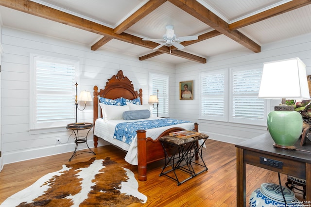 bedroom featuring beamed ceiling, ceiling fan, coffered ceiling, and hardwood / wood-style floors