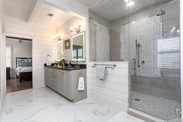 bathroom featuring vanity and a shower with shower door