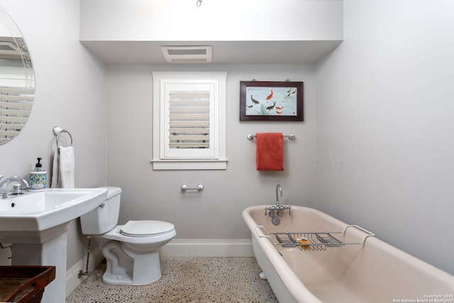 bathroom featuring a bathtub and toilet