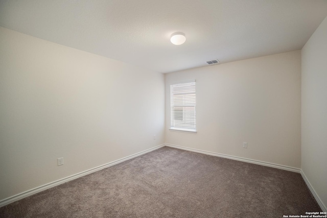 empty room featuring carpet floors