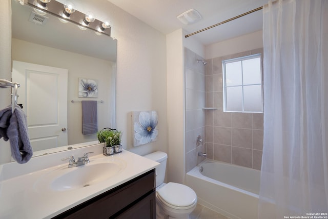 full bathroom with vanity, shower / tub combo, and toilet