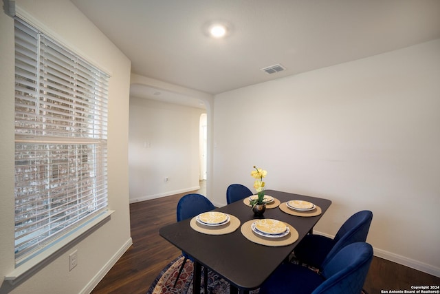 dining area with dark hardwood / wood-style floors