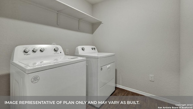 washroom featuring separate washer and dryer and dark hardwood / wood-style floors