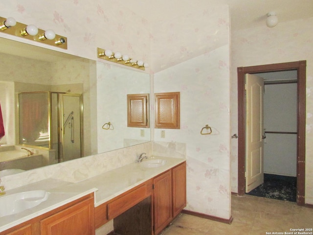 bathroom with walk in shower and vanity