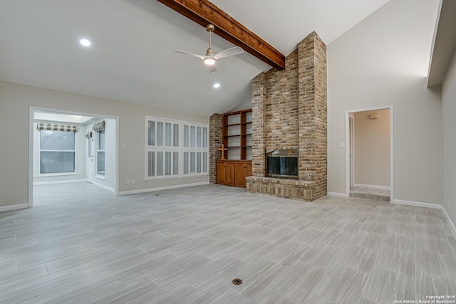 unfurnished living room featuring ceiling fan, beam ceiling, high vaulted ceiling, and a brick fireplace