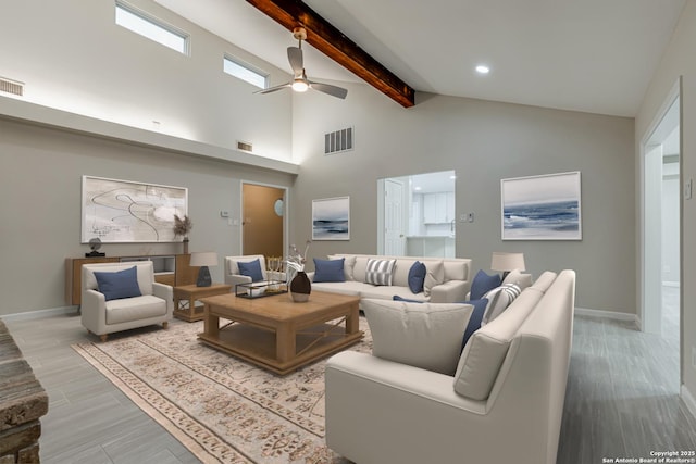 living room featuring ceiling fan, high vaulted ceiling, beam ceiling, and light hardwood / wood-style flooring