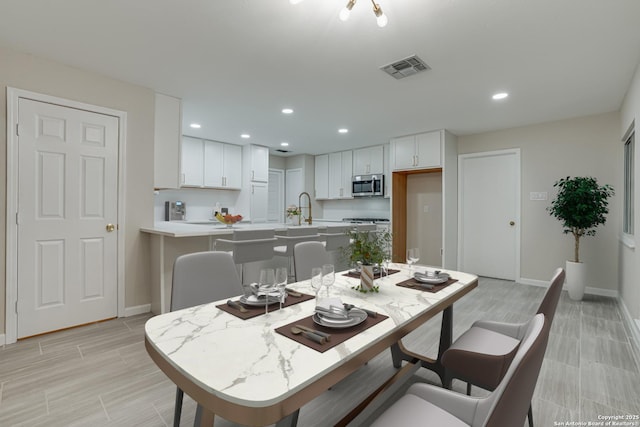 dining space featuring sink