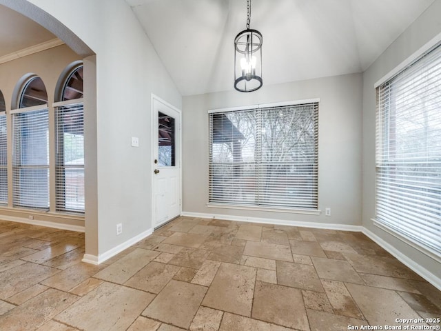 interior space with an inviting chandelier and lofted ceiling