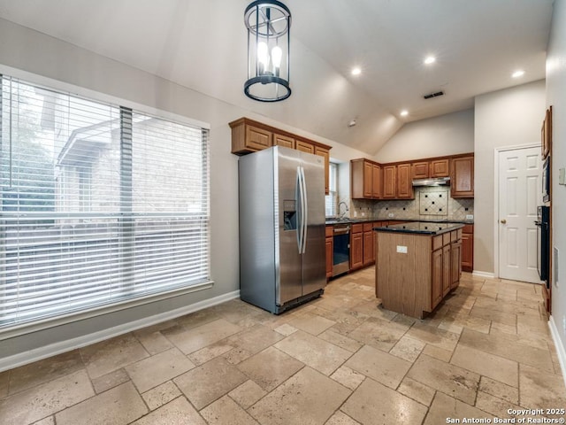 kitchen featuring a center island, stainless steel fridge with ice dispenser, dishwasher, oven, and backsplash