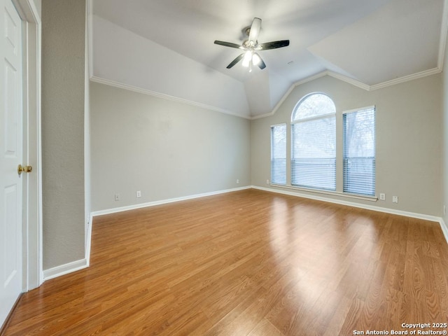 unfurnished room featuring ornamental molding, lofted ceiling, ceiling fan, and light hardwood / wood-style flooring