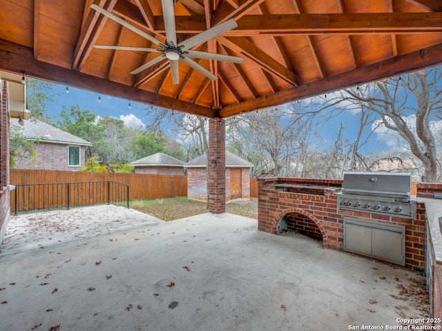 view of patio / terrace with an outdoor kitchen, area for grilling, and ceiling fan