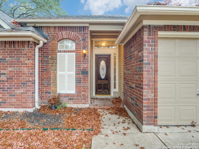 doorway to property featuring a garage